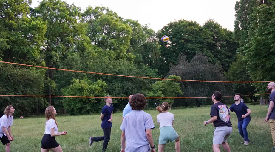 The team playing volleyball in the park